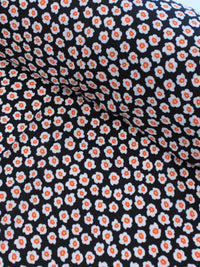 Tecido Crepe GGT Micro Floral Preto e Laranja