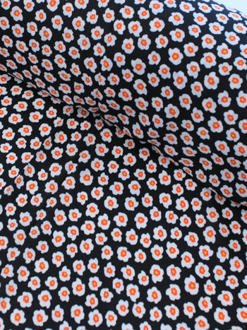Tecido Crepe GGT Micro Floral Preto e Laranja