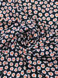 Tecido Crepe GGT Micro Floral Preto e Laranja